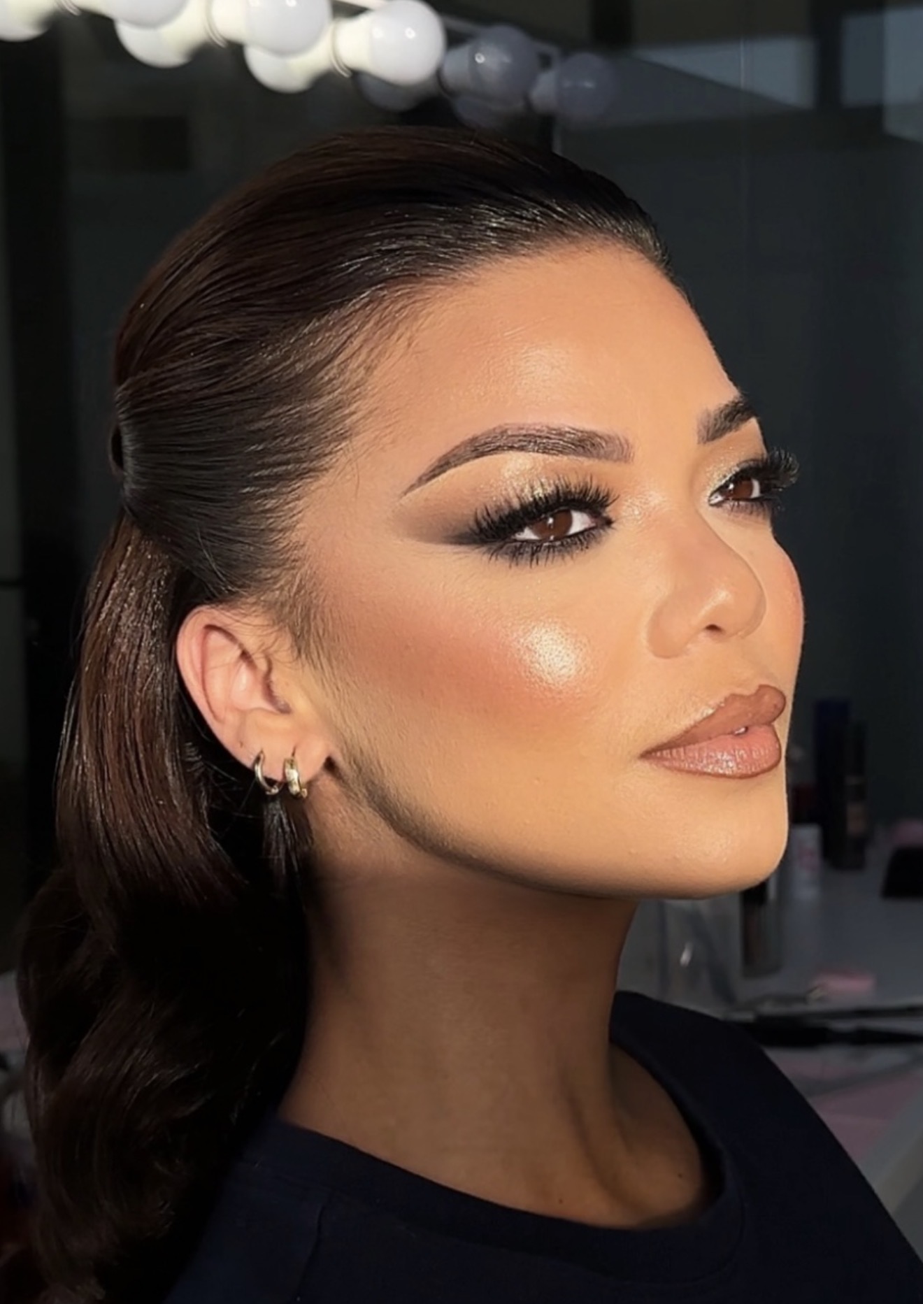 Profile glam makeup with sleek hair and glowing skin by RAUNAQ